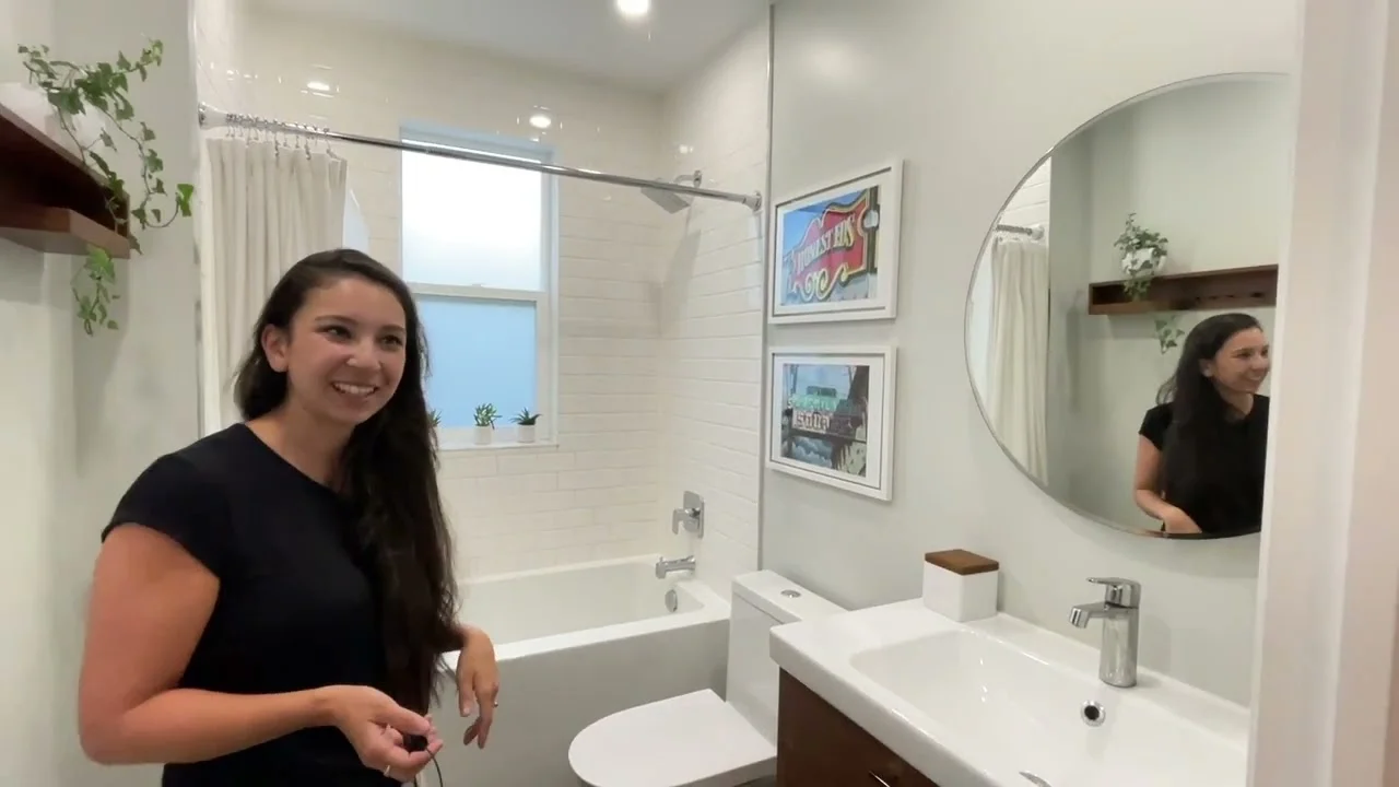 Nadia in the renovated space, from the video Bathroom renovation at Nadia’s home